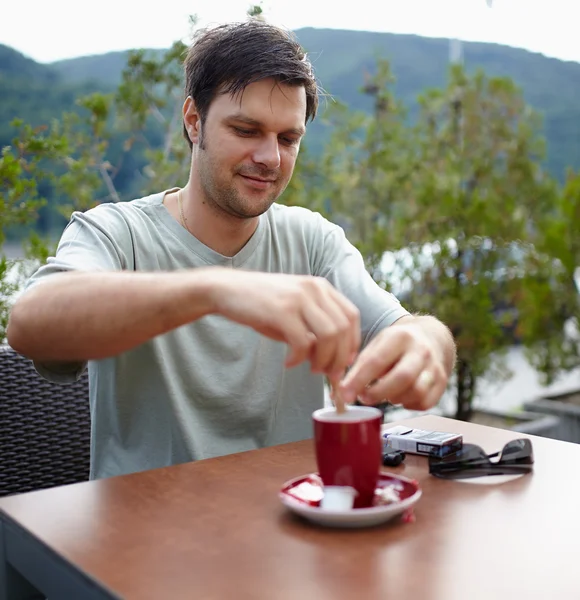 Man having coffee outdoor — Stock Photo, Image