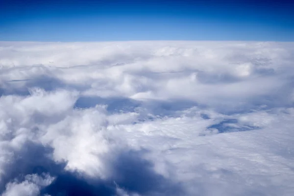 Sea of clouds, flying above them in the stratosphere