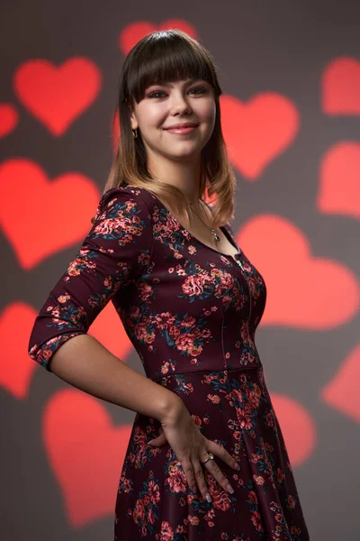 Attractive Young Woman Floral Dress Hearts Background — Fotografia de Stock