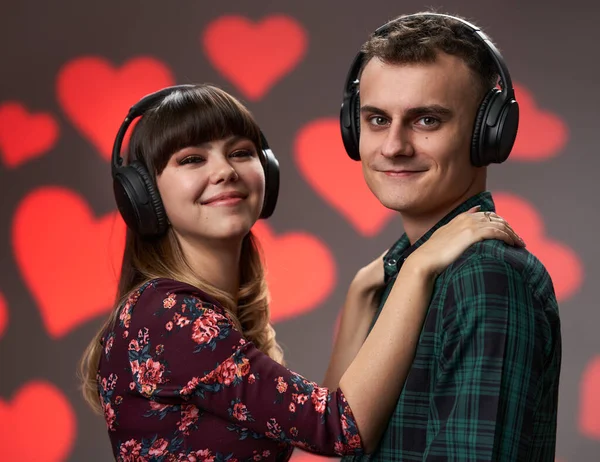 Young Lovely Couple Listening Together Music Headphones Hearts Background Valentine — Fotografia de Stock