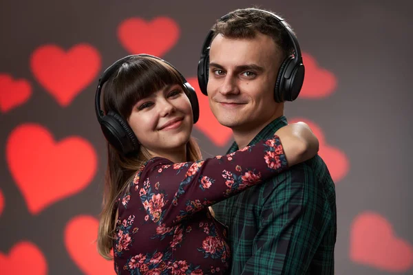 Young Lovely Couple Listening Together Music Headphones Hearts Background Valentine — Fotografia de Stock