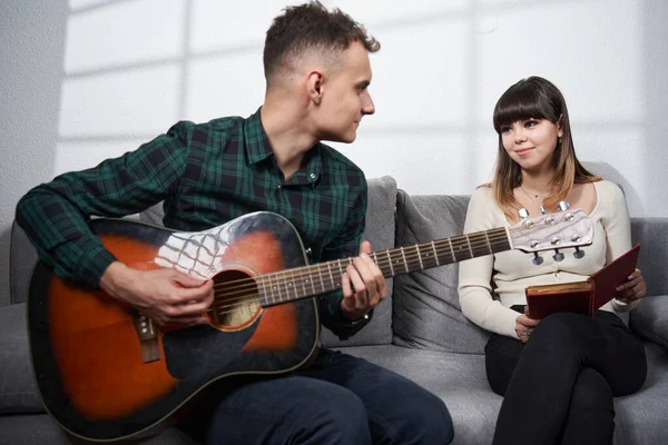 Couple Having Great Time Young Man Playing Guitar While Girl — Zdjęcie stockowe