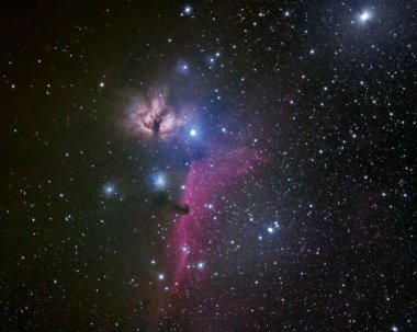 Horsehead and Flame nebulae in the winter night sky, shot with personal telescope