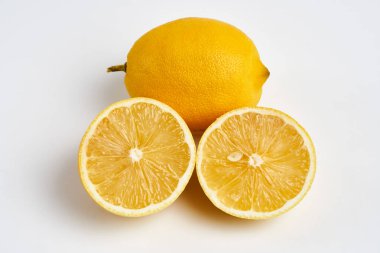 Closeup of a whole lemon isolated on white background