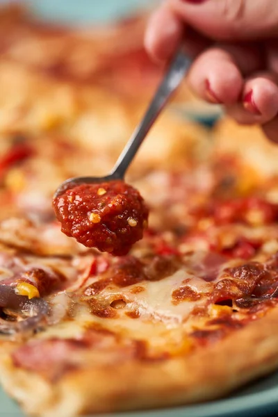 Female Hand Spreading Hot Sauce Pizza Slices Closeup — Stock Photo, Image