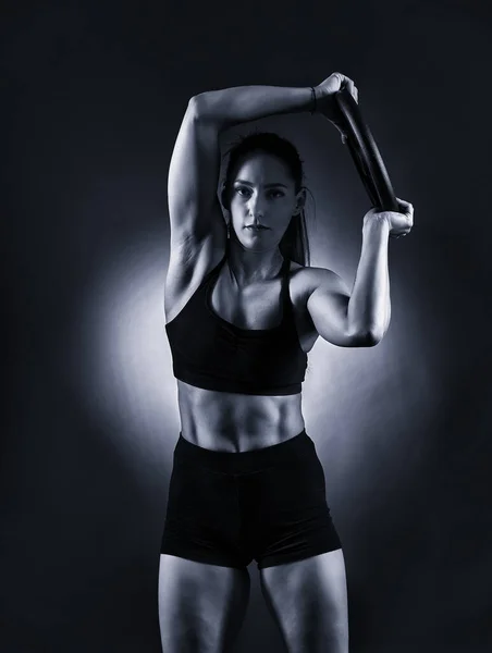 Athletic Woman Doing Abs Workout Heavy Gym Plate Monochrome Toned — Fotografia de Stock