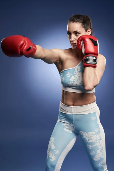 Young Woman Boxer Red Boxing Gloves Training Blue Background — Stockfoto