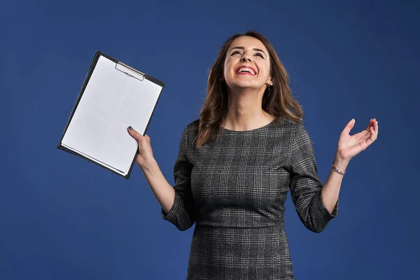 Happy Successful Business Woman Clipboard Celebrating Success Isolated Blue Background — Fotografia de Stock