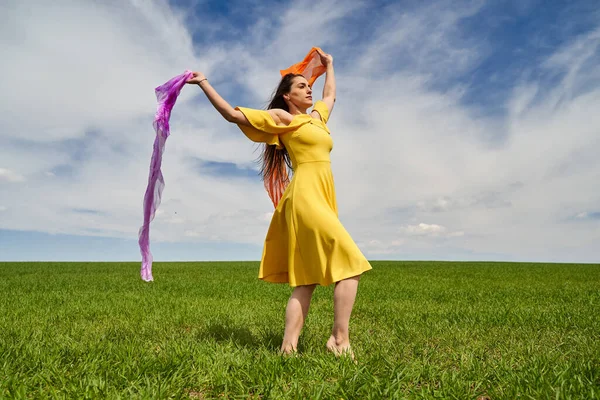 Young Woman Yellow Dress Green Wheat Field Sunny Day — Zdjęcie stockowe