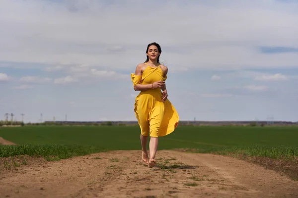 Barefoot Young Woman Yellow Dress Dirt Road Wheat Fields — 스톡 사진