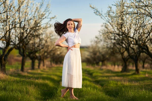 Portrait Beautiful Caucasian Woman White Dress Blooming Plum Orchard — Stok fotoğraf