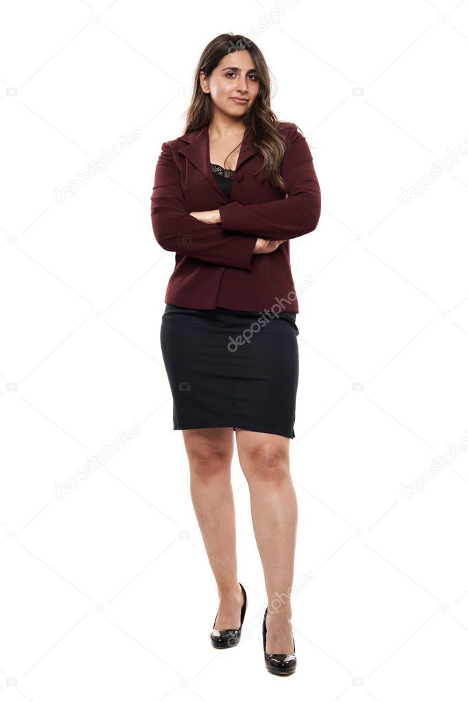 Full length portrait of a young Indian businesswoman in formal office attire, isolated on white background