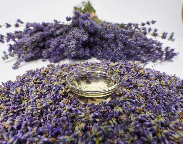 Lavender products and fresh bouquet in closeup on white background