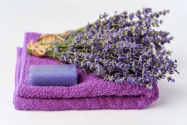 Lavender products and fresh bouquet in closeup on white background