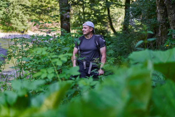 Male Photographer Hiking Trail Lush Forest His Backpack —  Fotos de Stock