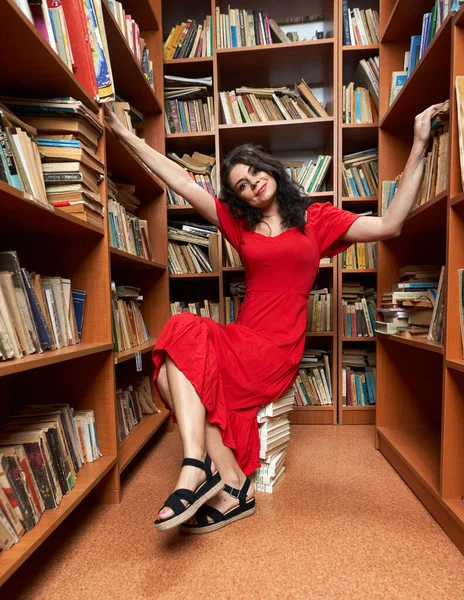 Beautiful Woman Red Dress Library Sitting Stack Books Reading — Stockfoto