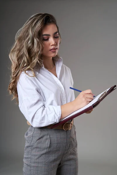 Closeup Very Attractive Young Businesswoman Clipoboard Documents Gray Background — Stock Photo, Image