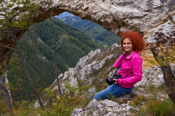 Woman Hiker Camera Resting Natural Rock Portal Mountains — Stock Photo, Image