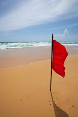 Red warning flag at the beach.