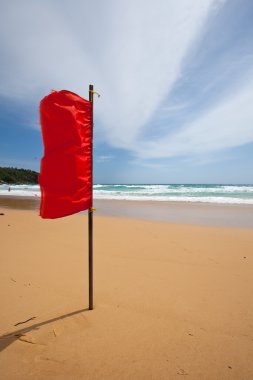 Red warning flag at the beach.
