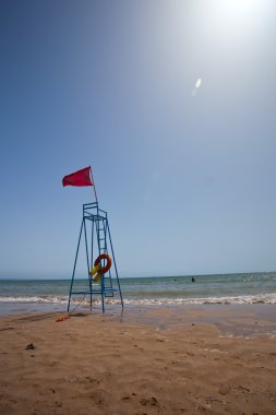 Red warning flag at the beach.