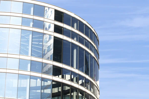 Modern round building on blue sky background — Stock Photo, Image