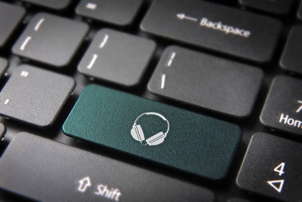Green Headphones keyboard key, Entertainment background — Stock Photo, Image