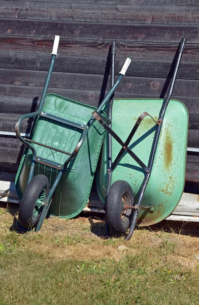 Green wheelbarrows — Stock Photo, Image