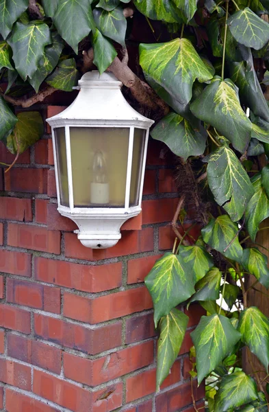 White lamp on brick wall — Stock Photo, Image