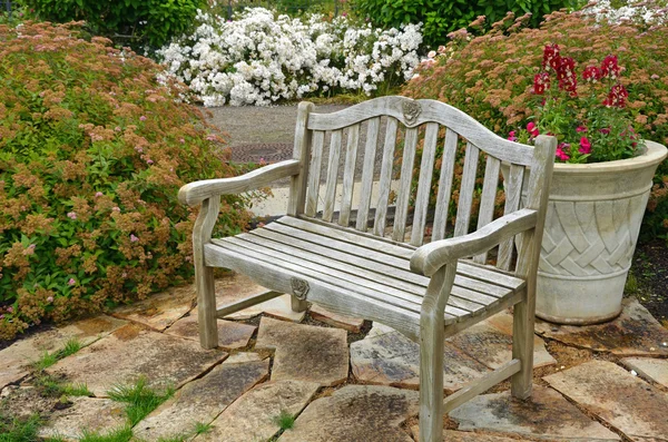 Garden bench on patio — Stock Photo, Image