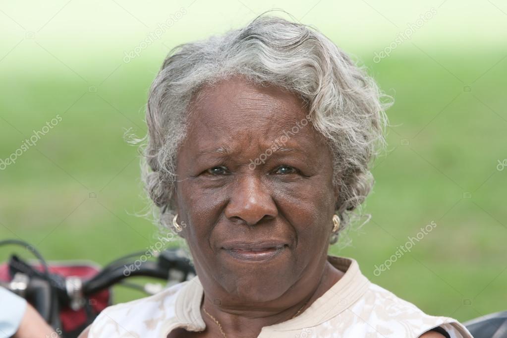 Elderly african american lady outside Stock Photo by ©beichh4046