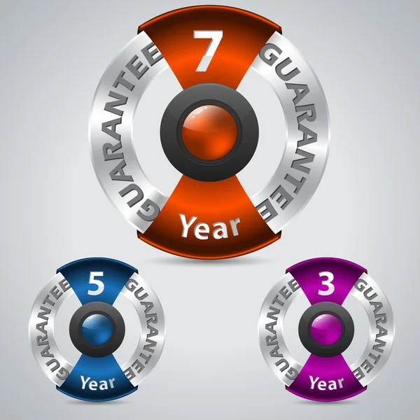 Badges de garantie métallique avec rubans de couleur — Image vectorielle