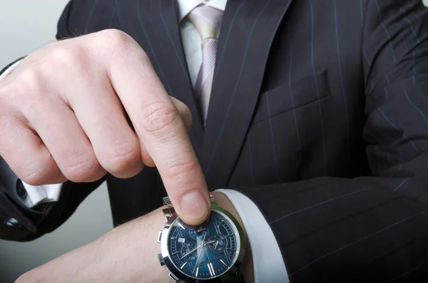 Businessman pointing at his watch — Stock Photo, Image