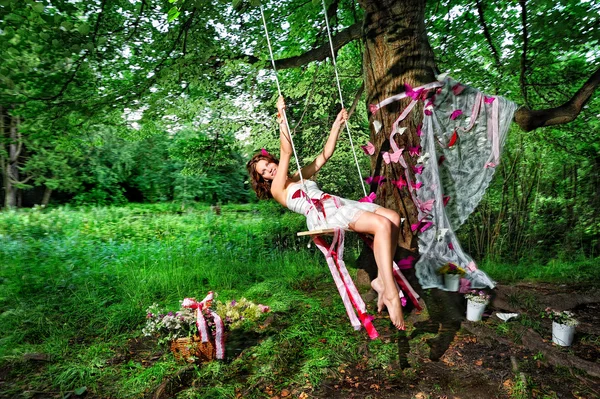 Fairy swinging on teeterboard — Stock Photo, Image