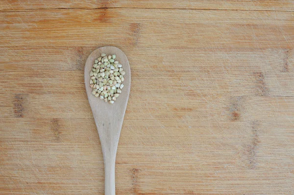 Organic food background with green buckwheat — Stock Photo, Image