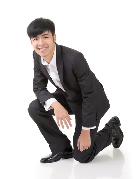 Asiático homem de negócios squat — Fotografia de Stock