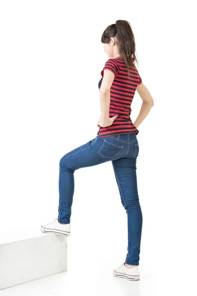 Full legth portrait of asian woman on stairs — Stock Photo, Image