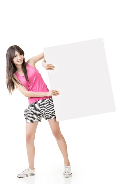 Young pretty woman holding a blank — Stock Photo, Image