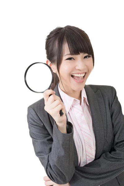 Young asian businesswoman holding magnifying glass. — Stock Photo, Image