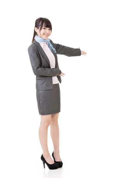 Attractive business woman showing or introducing. — Stock Photo, Image