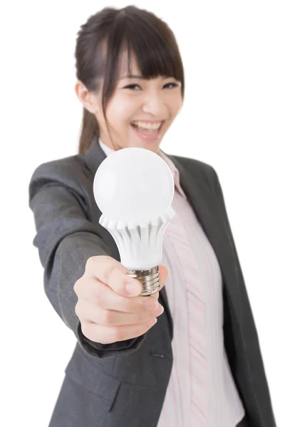 Asian businesswoman with a light bulb — Stock Photo, Image