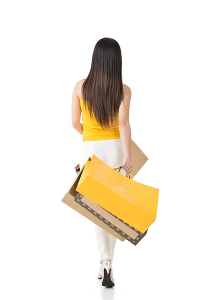 Attractive asian woman holding shopping bags — Stock Photo, Image