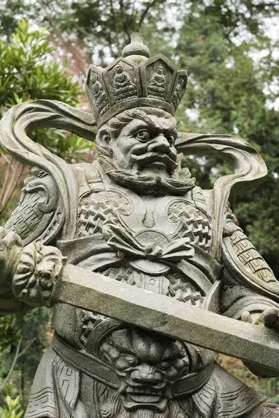 Aged asian god statue — Stock Photo, Image