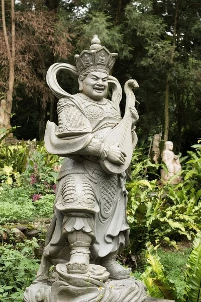 Envejecido asiático dios estatua — Foto de Stock