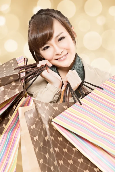 Glimlachend winkelen meisje — Stockfoto