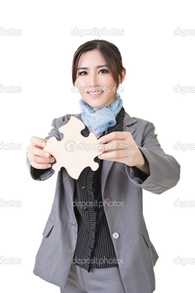 business woman hold a wooden puzzle