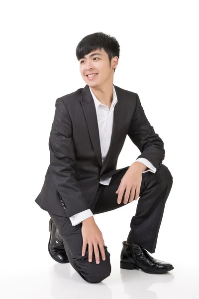 Azjatycki biznes człowiek squat — Zdjęcie stockowe
