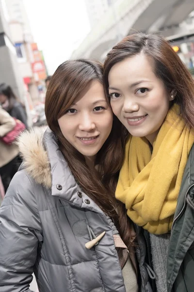 Happy smiling Asian women in city — Stock Photo, Image