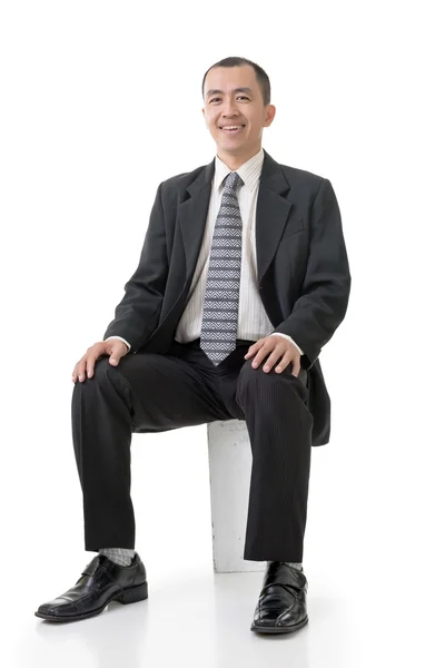 Amichevole asiatico affari uomo sit — Foto Stock