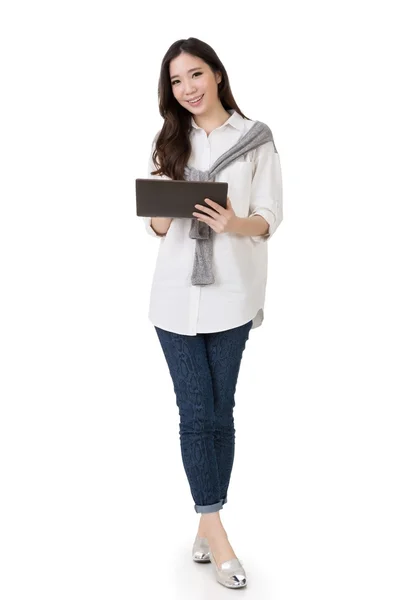 Attractive young Asian woman using pad — Stock Photo, Image